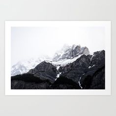 the mountains are covered with snow in this black and white photo art print by artist mark smith