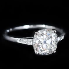 an oval cut diamond ring with baguettes on the sides