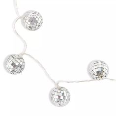 silver disco ball string lights on a white background