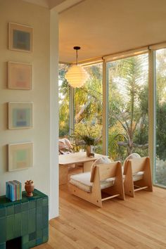 a living room filled with furniture and lots of windows