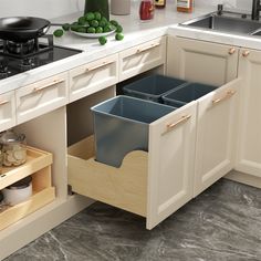 an open drawer in the middle of a kitchen