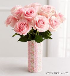 pink roses in a vase on a table