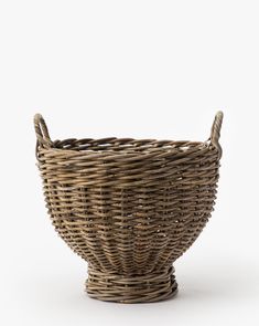 a wicker basket on a white background with no one in it or someone else