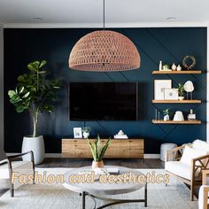 a living room filled with furniture and a flat screen tv mounted on a wall next to a potted plant