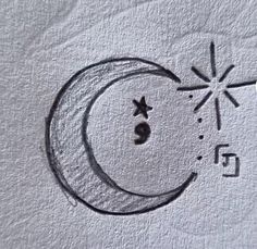 a drawing of the moon and stars on paper