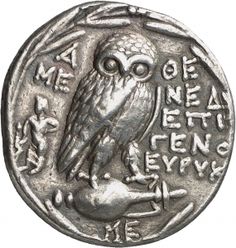 an ancient coin with an owl on it