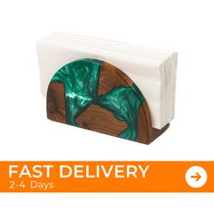 the fast delivery card holder is made out of wood and has green marble on it