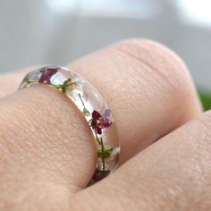 a woman's wedding ring with flowers on it