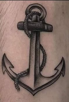 an anchor tattoo on the leg