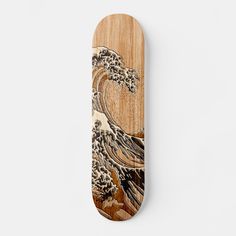 a wooden skateboard with an image of a wave on it