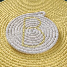 a yellow rug with a white circle on it