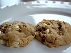 two cookies sitting on top of a white plate