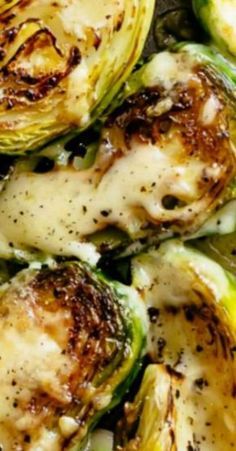 grilled brussel sprouts with melted cheese and seasoning on top