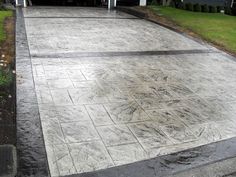 a driveway that has been cleaned and is in the process of being paved with concrete