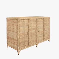 a wicker cabinet with four doors and three drawers on one side, against a white background