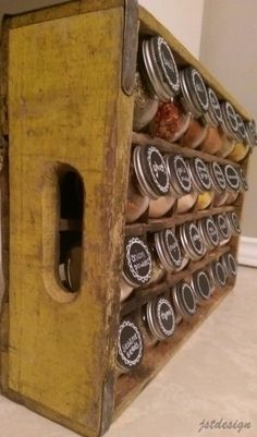 an old wooden box filled with lots of jars