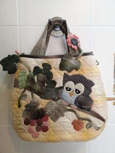 an owl purse hanging on the wall