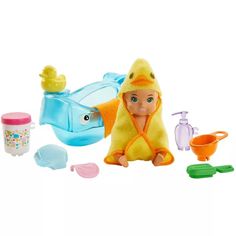 a baby doll is sitting in front of the toy bathtub and toys on the floor