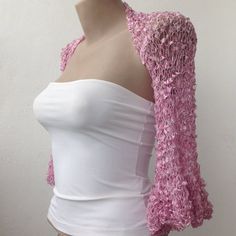 This Pink Ruffle Sleeves Silky Bolero is a perfect accessory for your summer outfit. It gives an elegant silky touch and is proper for the late spring and the summer months. Be the star at the dancing with this lightweight loose shrug. It matches perfectly with an evening dress as well over a party top.   This bolero is quite stretchy. Ask for a Custom order to fit exactly your size ot choose it according to the measures given below. It is available in Plus size also. Please contact us to send u Spring Party Crochet Top, Long Sleeve Crochet Top For Summer Parties, Elegant Summer Crochet Top, Long Sleeve Summer Shrug For Party, Spring Party Lace Crochet Top, Spring Party Long Sleeve Crochet Top, Spring Party Crochet Top With Long Sleeves, Feminine Crochet Top For Spring Party, Fitted Long Sleeve Crochet Party Top