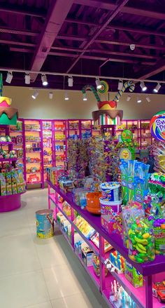 the inside of a toy store filled with lots of toys and candy bars on display