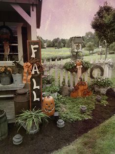 an outdoor halloween scene with pumpkins and other decorations