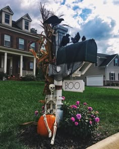 a mailbox decorated with skeletons and pumpkins