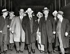 black and white photograph of men in suits and hats