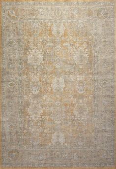 an antique rug with yellow and grey colors