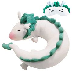 a white and green stuffed animal next to each other