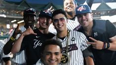 a group of baseball players standing next to each other