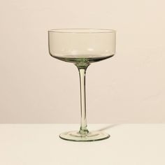 an empty wine glass sitting on top of a table