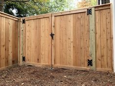 a wooden fence with two gates on each side