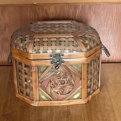 a decorative wooden box sitting on top of a table