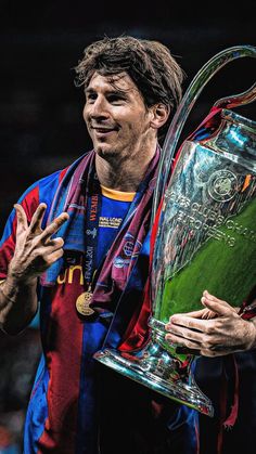 a man holding a trophy in his hands