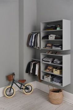 a child's bike is sitting in front of a closet