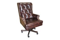 a brown leather office chair sitting on top of a wooden desk