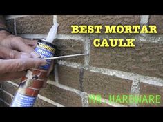 a man is painting a brick wall with the words best mortar caulk