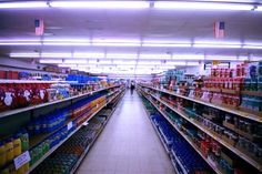 an aisle in a grocery store filled with lots of food