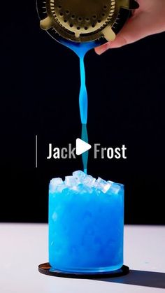 a person pouring blue liquid into a glass with ice in it and the words jack frost on