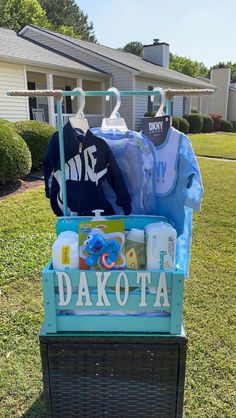 a display in the grass with shirts and other items