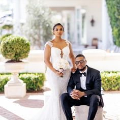 a bride and groom pose for a wedding photo