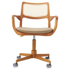 an office chair with wheels on the back and seat upholstered in beige fabric