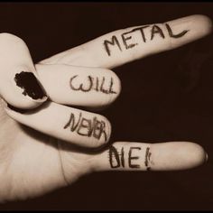 a hand with writing on it that says metal