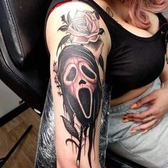 a woman with a tattoo on her arm