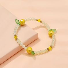 This Unique Piece Is A Wonderful Addition To Your Wardrobe And Your Style; Sure To Get Lots Of Compliments! Gshmh60060001p9 Yellow Bracelet Beads, Kawaii Bracelet, Fruit Bracelet, Bead Jewelry Ideas, Style Roots, Diy Beading, Yellow Bracelet, Jewellery Business, Bracelet Inspo