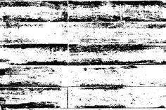 black and white photograph of wood planks that have been stripped in several different directions