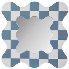 a blue and white checkerboard pattern with a square shaped mirror