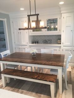 a kitchen table with two benches in front of it