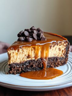 a piece of cheesecake with chocolate and caramel drizzled on top