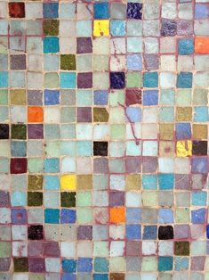 an abstract mosaic design with multicolored tiles